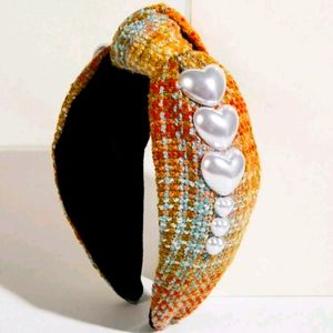 Headbands with brown tones and pearl hearts